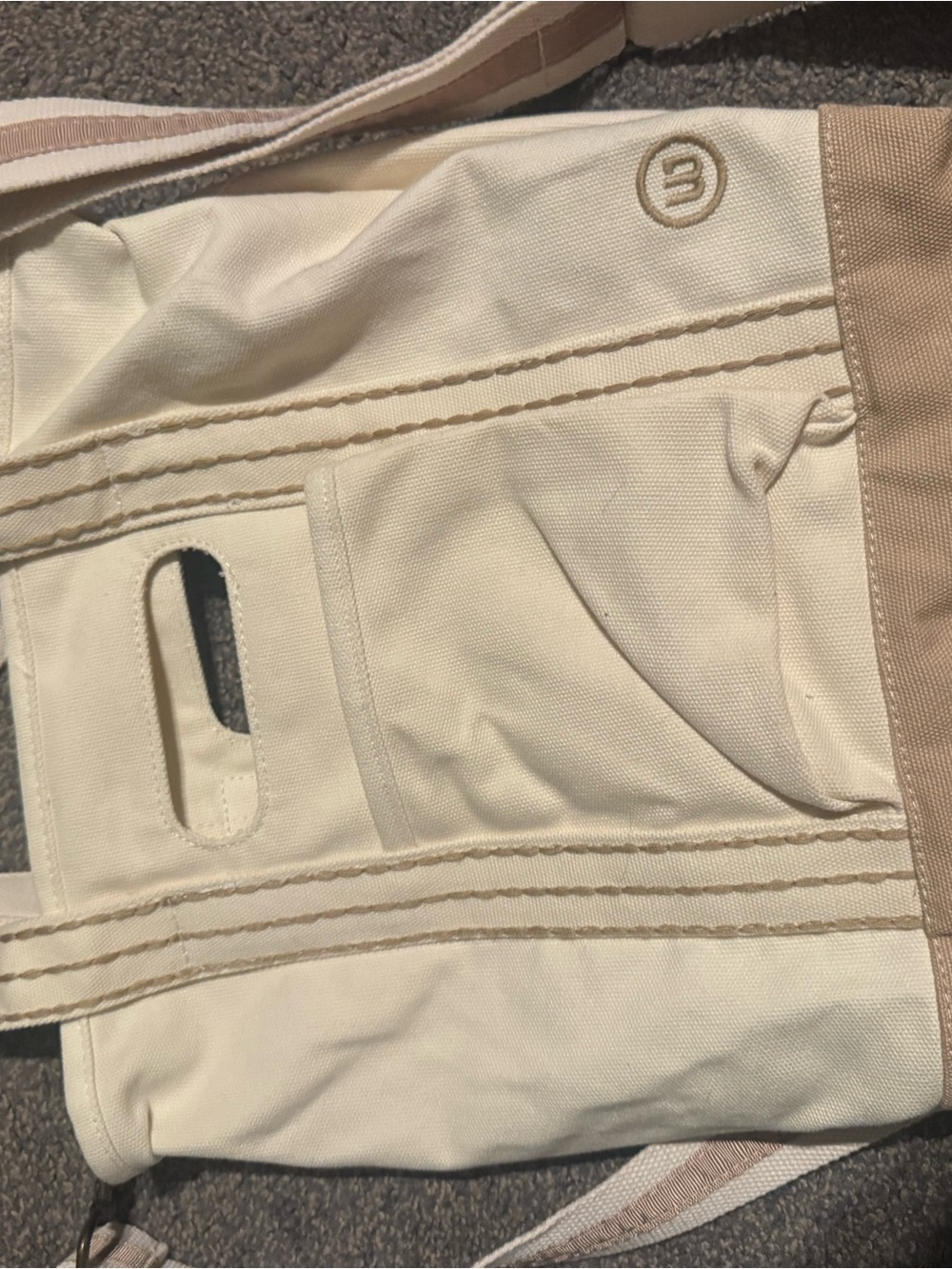 Cream Canvas Tote with Tan Accents and Embossed Logo